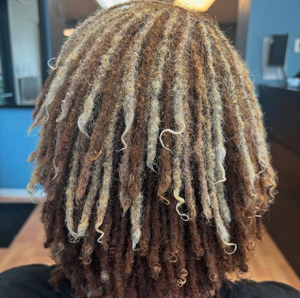 Close up of blonde curly loc tips