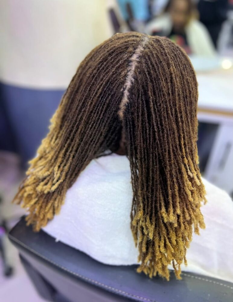 Precise center-part dreadlocks, back view