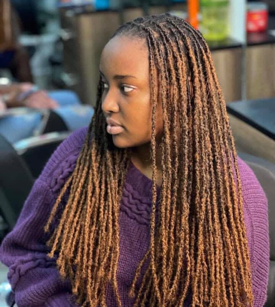 Copper-toned faux locs, side profile